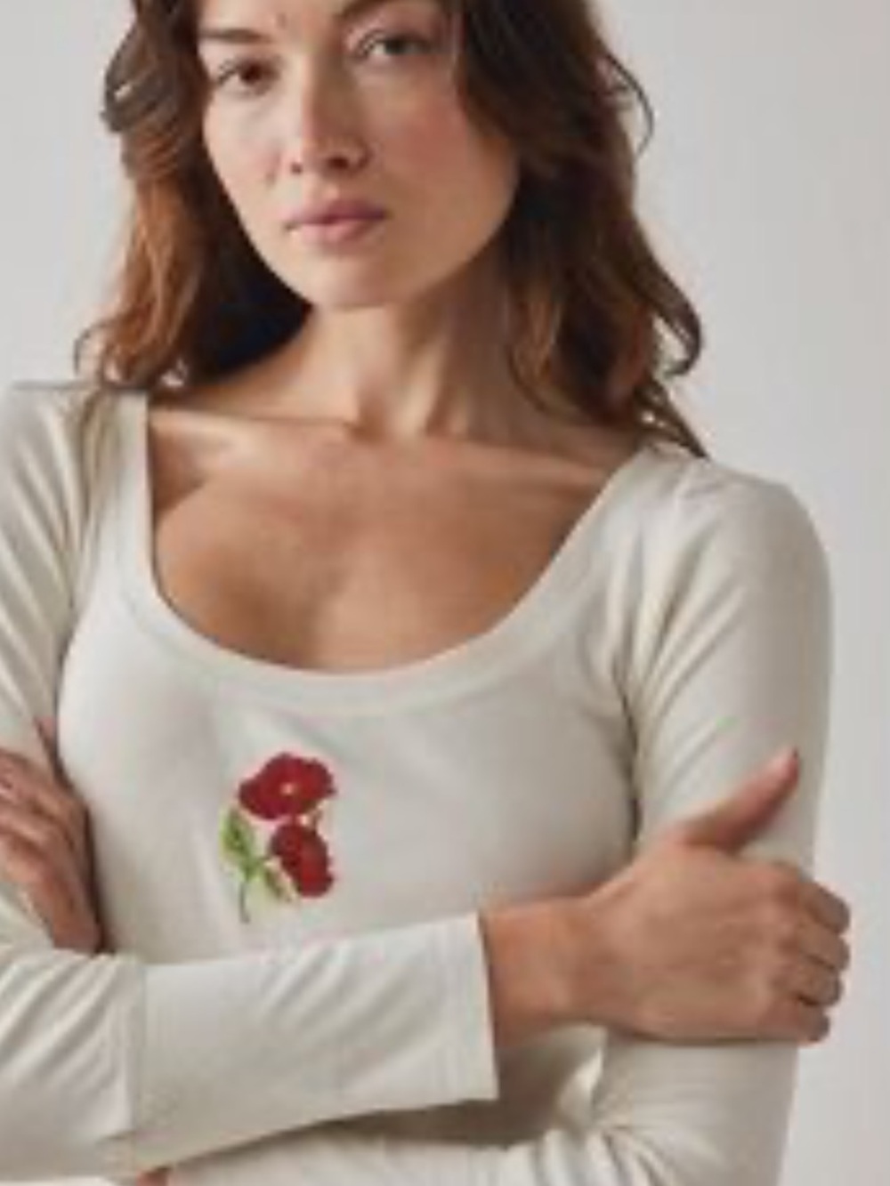 Free People "at the Park" Cream Long Sleeve Crop Top with Red Floral Embroidery.
